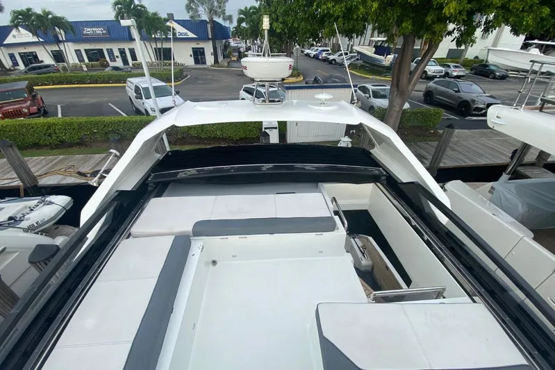 Dream Yacht Photos Pics 2019 Galeon 470 Sky yacht with spacious deck and modern design in marina setting.