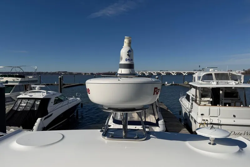 Dream Yacht Photos Pics 2019 Galeon 470 Sky yacht docked, featuring radar and FLIR system, under clear blue sky.