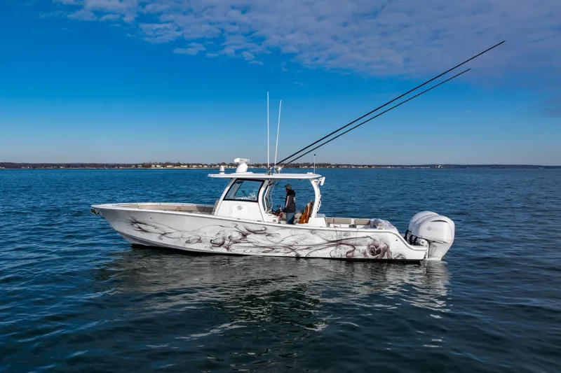 What A County Yacht Photos Pics 2022 Sportsman Open 352 Center Console boat on calm blue water under clear sky.