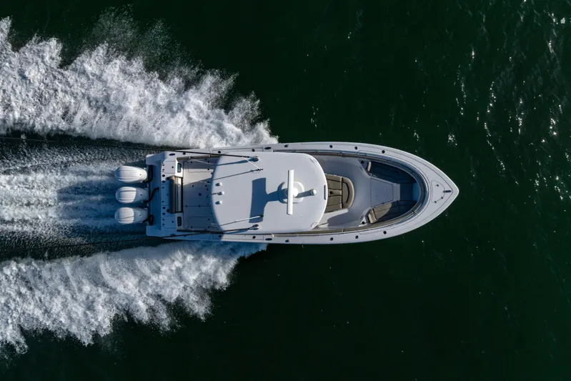 What A County Yacht Photos Pics Aerial view of 2022 Sportsman Open 352 Center Console boat speeding on water.