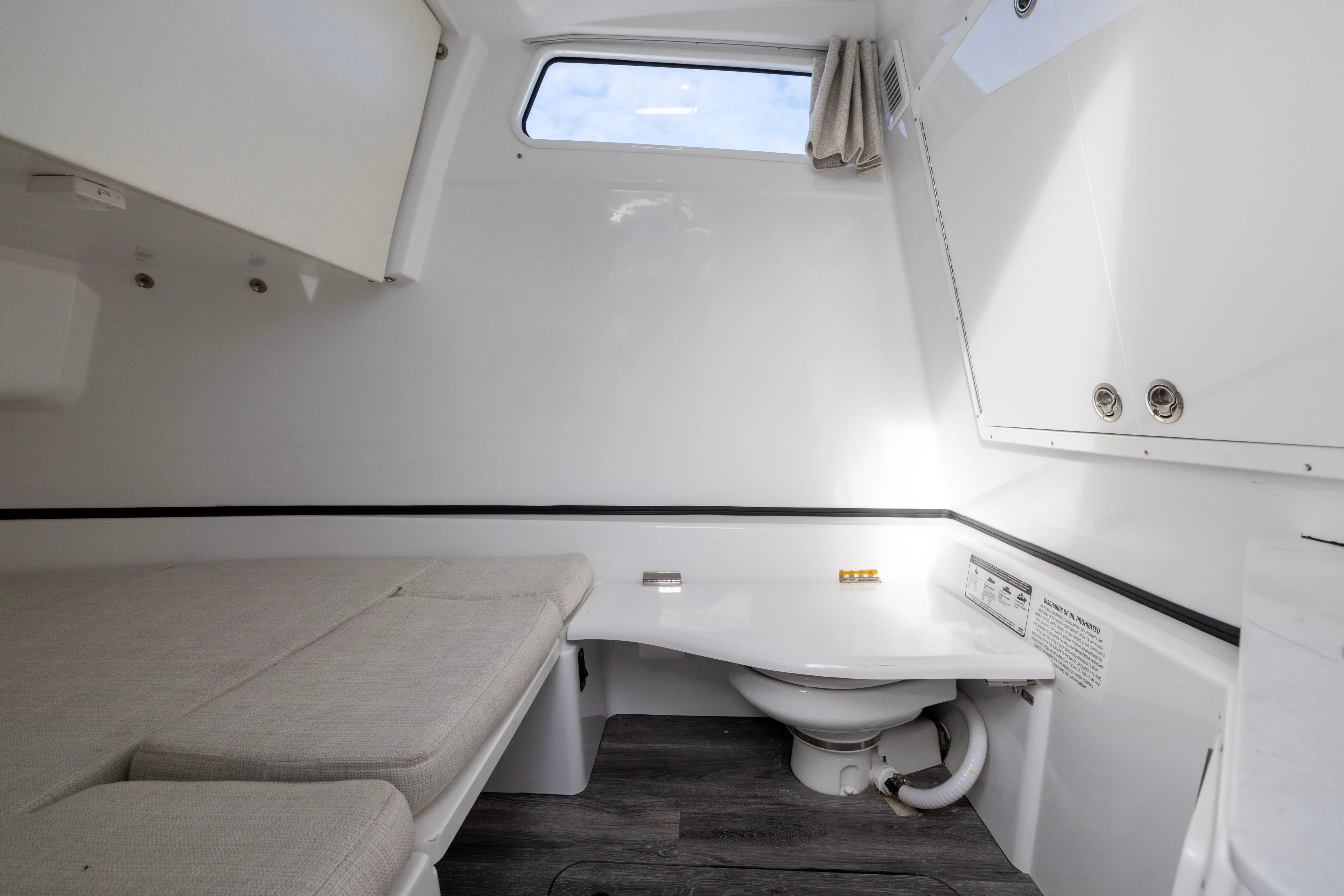 What A County Yacht Photos Pics 2022 Sportsman Open 352 Center Console cabin interior with bed and toilet.