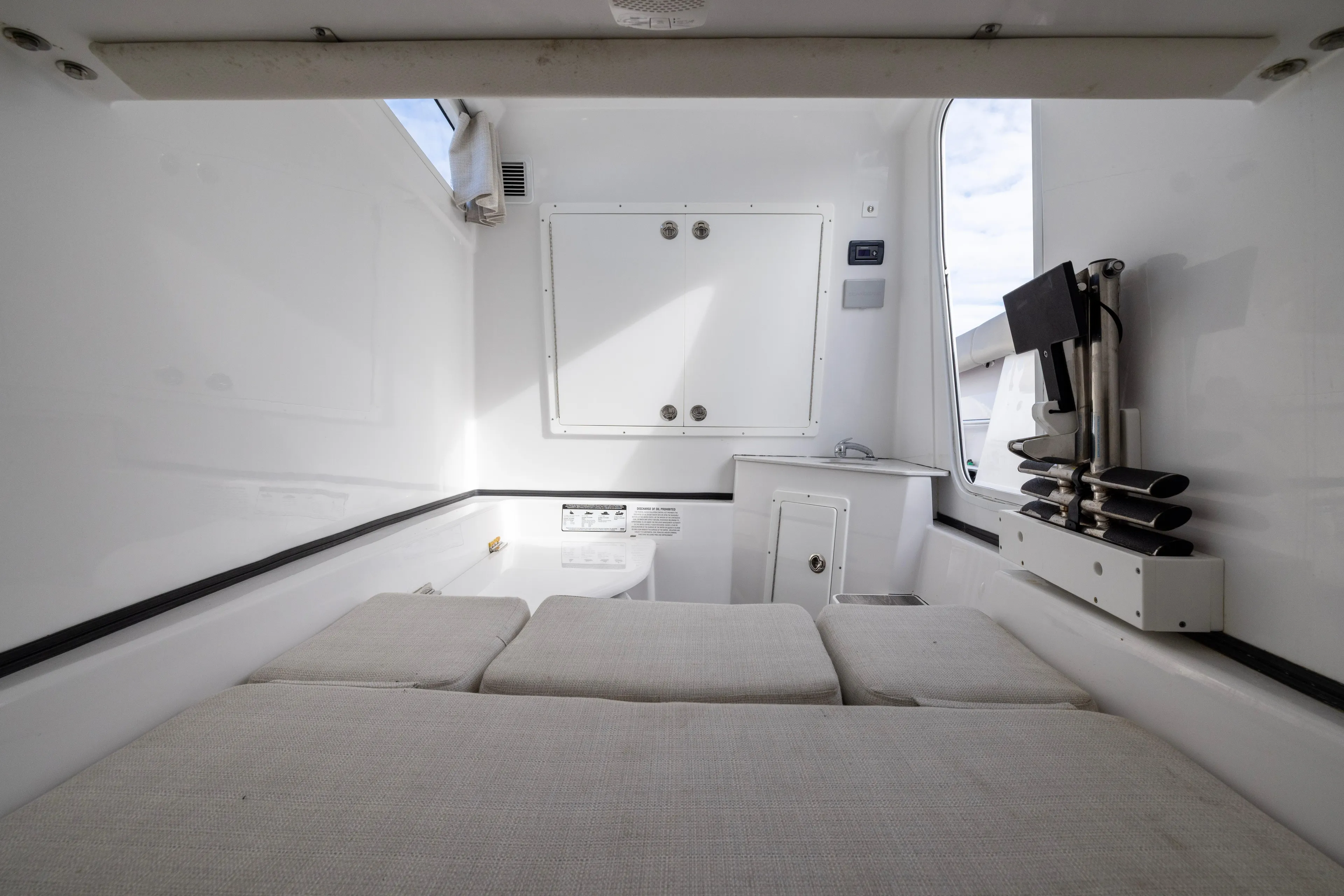 What A County Yacht Photos Pics 2022 Sportsman Open 352 Center Console cabin interior with seating and storage.