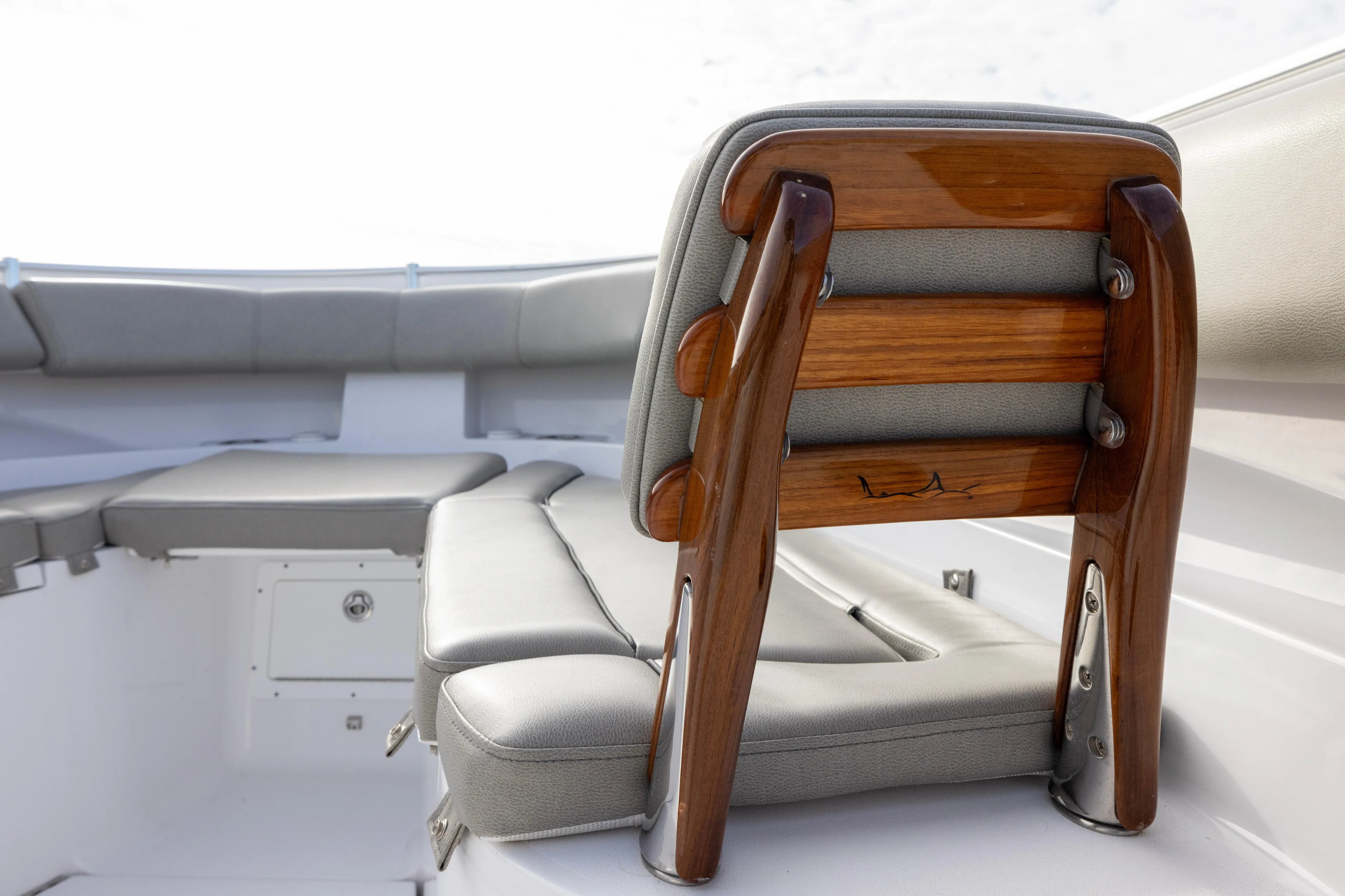 What A County Yacht Photos Pics 2022 Sportsman Open 352 Center Console boat with cushioned seating and wooden accents.