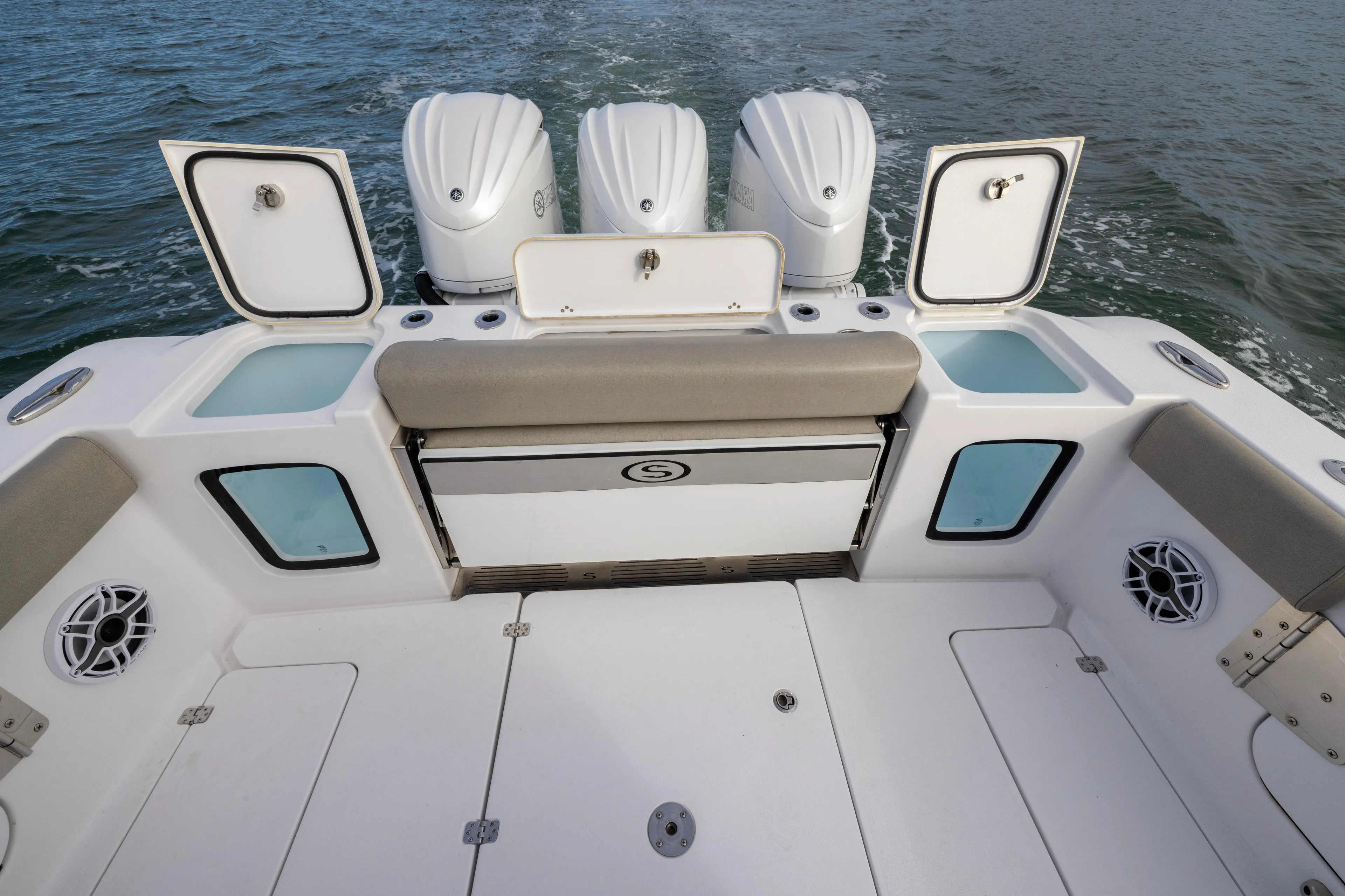 What A County Yacht Photos Pics 2022 Sportsman Open 352 Center Console boat with triple engines and open storage compartments.