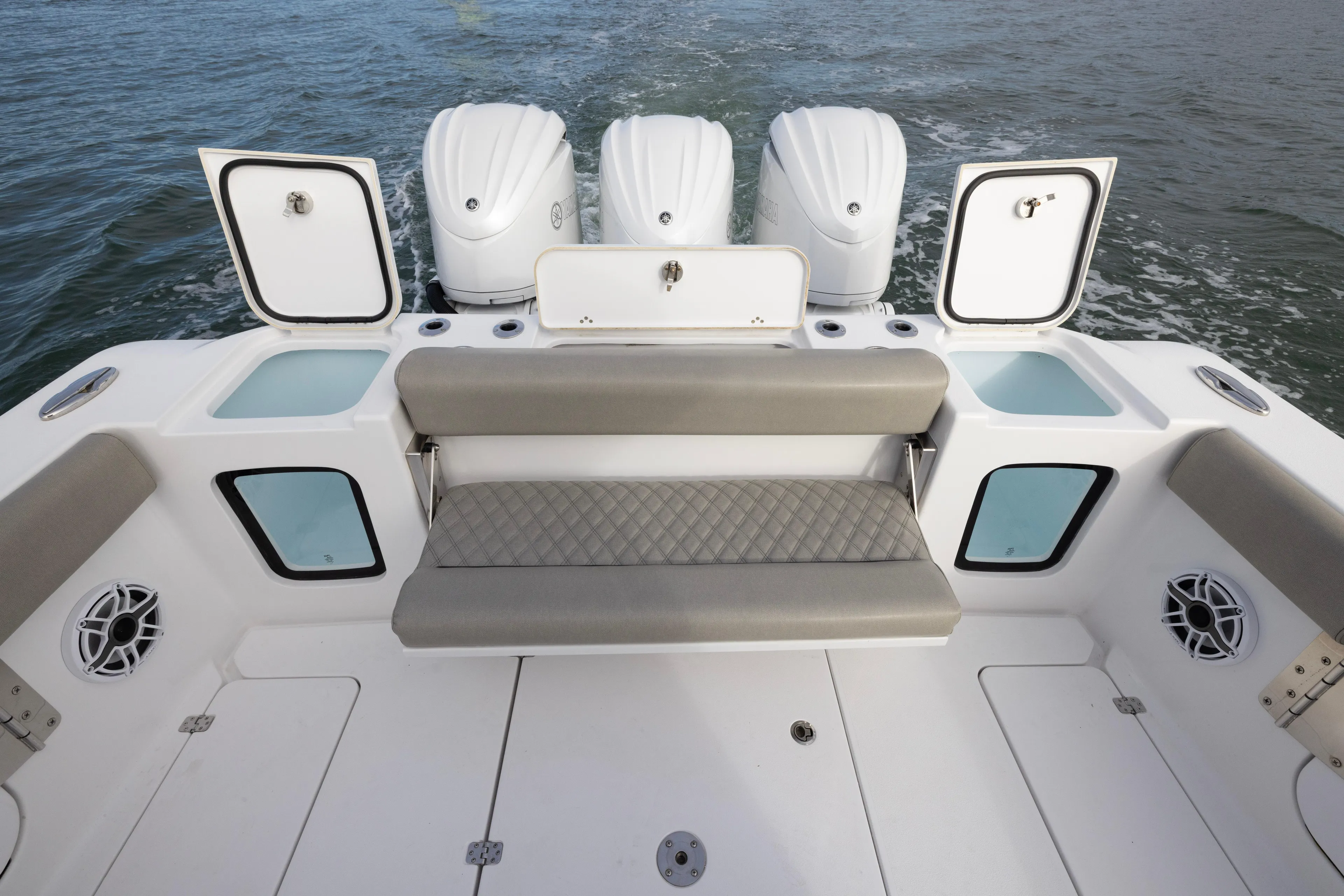 What A County Yacht Photos Pics 2022 Sportsman Open 352 Center Console boat with triple engines and seating area.