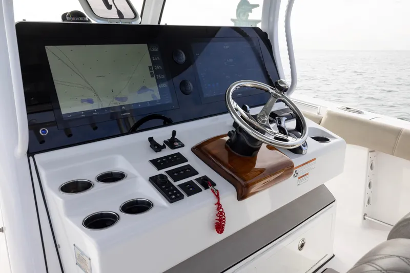 What A County Yacht Photos Pics 2022 Sportsman Open 352 Center Console dashboard with steering wheel and navigation screens.