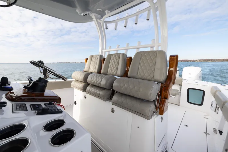 What A County Yacht Photos Pics 2022 Sportsman Open 352 Center Console boat interior with luxurious seating and steering console.