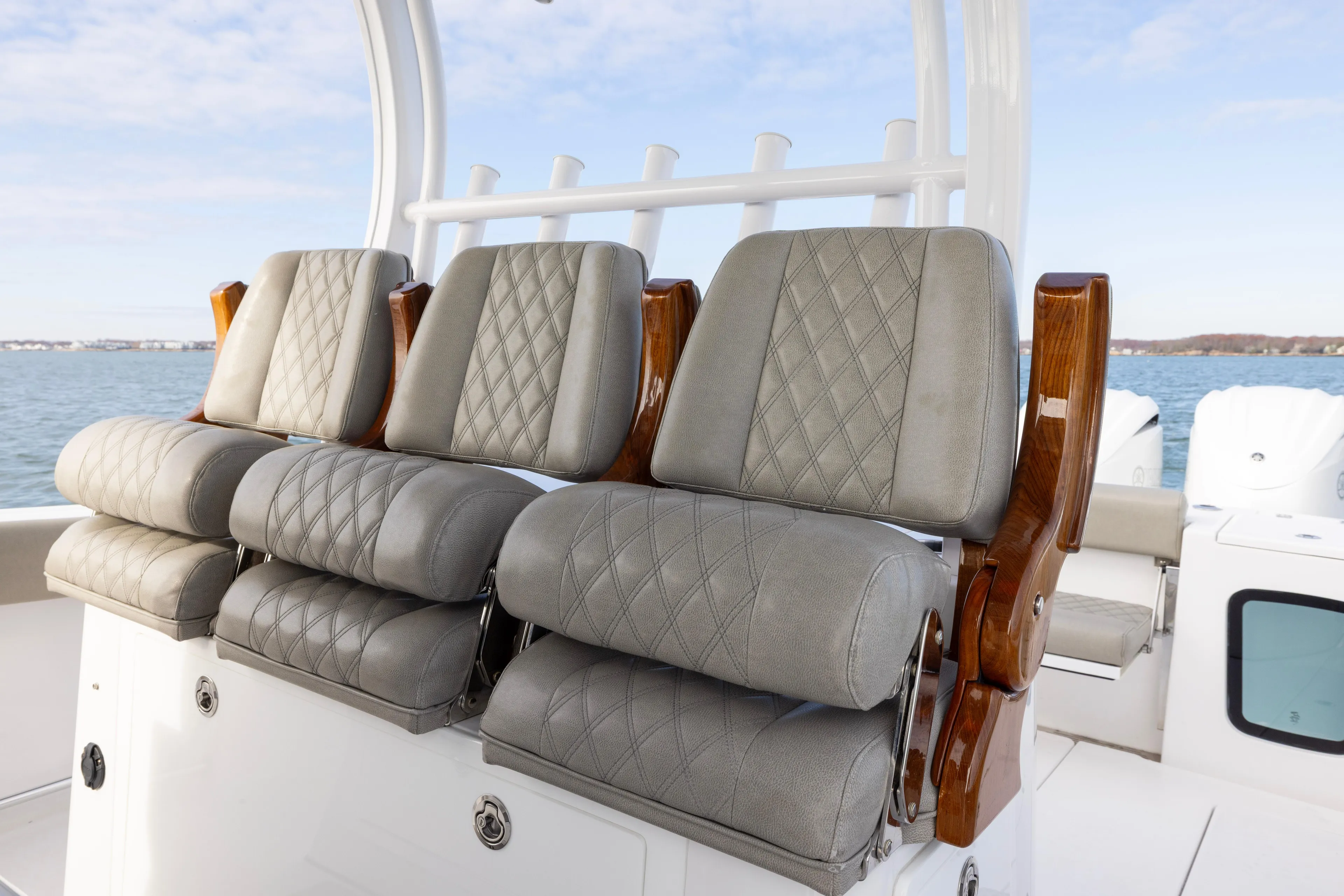 What A County Yacht Photos Pics 2022 Sportsman Open 352 Center Console boat with luxurious seating and ocean backdrop.