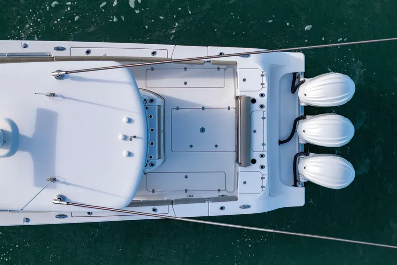 What A County Yacht Photos Pics Top view of 2022 Sportsman Open 352 Center Console boat on water.
