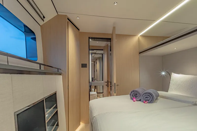 Jack Yacht Photos Pics Luxurious interior of 2023 McConaghy MC75 yacht bedroom with modern design and cozy ambiance.