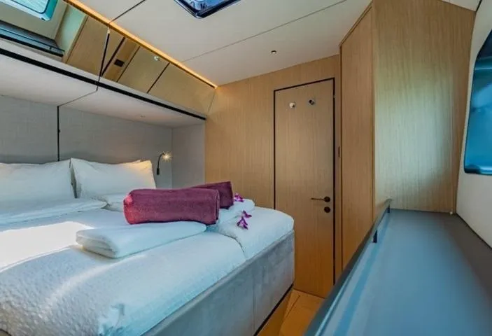 Jack Yacht Photos Pics Luxurious cabin interior of 2023 McConaghy MC75 yacht with cozy bed and modern design.