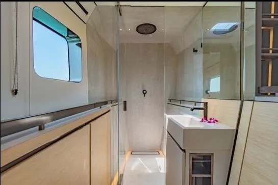 Jack Yacht Photos Pics Luxurious bathroom interior of 2023 McConaghy MC75 yacht with modern design and glass shower.
