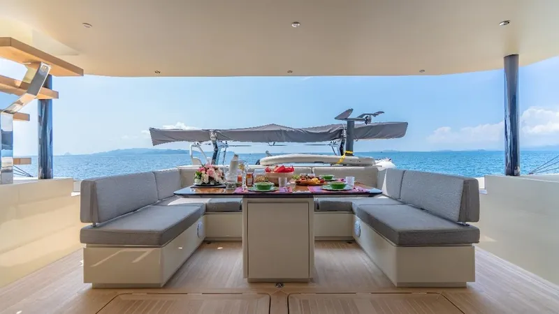 Jack Yacht Photos Pics Luxurious 2023 McConaghy MC75 yacht interior with elegant seating and ocean view.