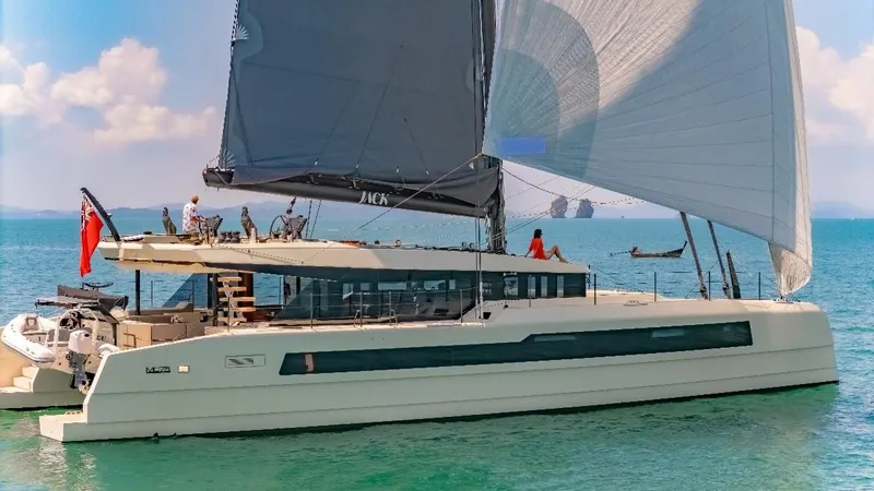 Jack Yacht Photos Pics 2023 McConaghy MC75 yacht sailing on turquoise waters under clear skies.