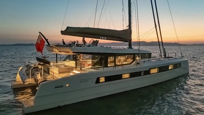 Jack Yacht Photos Pics 2023 McConaghy MC75 yacht sailing at sunset on calm waters.