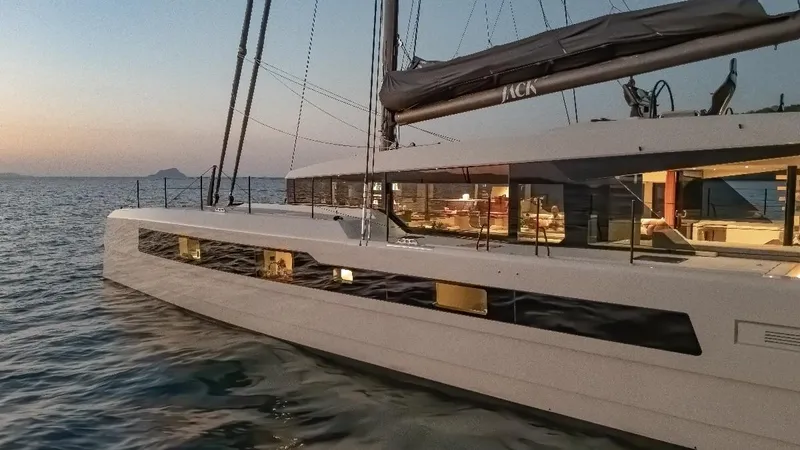 Jack Yacht Photos Pics 2023 McConaghy MC75 yacht sailing at sunset, showcasing sleek design and luxury interiors.