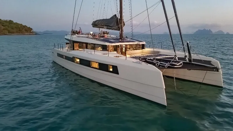 Jack Yacht Photos Pics Luxury McConaghy MC75 catamaran sailing at sunset, 2023 model.