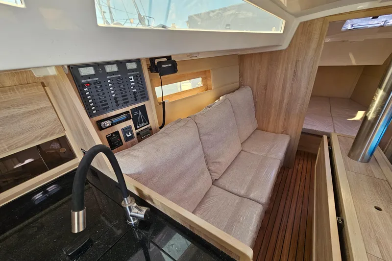  Yacht Photos Pics Interior of 2023 Viko Yachts S35, featuring cozy seating and modern control panel.