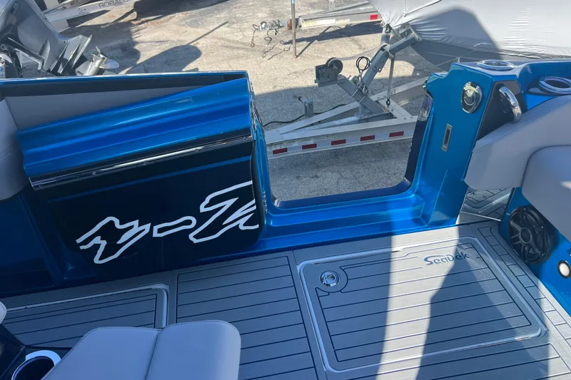  Yacht Photos Pics 2026 Nor-Tech 450 Sport boat interior with blue accents and SeaDek flooring.