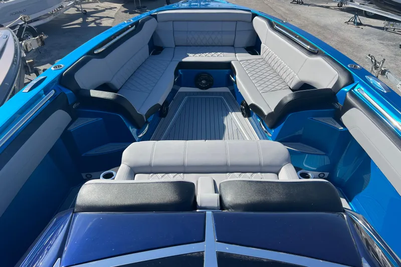  Yacht Photos Pics 2026 Nor-Tech 450 Sport boat interior with luxurious seating and sleek blue design.