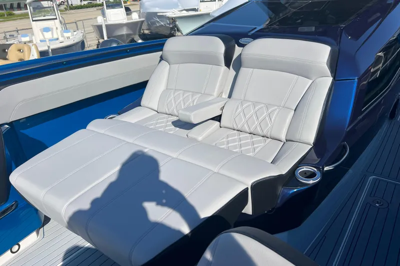  Yacht Photos Pics Luxurious seating on 2026 Nor-Tech 450 Sport boat, featuring elegant white upholstery.