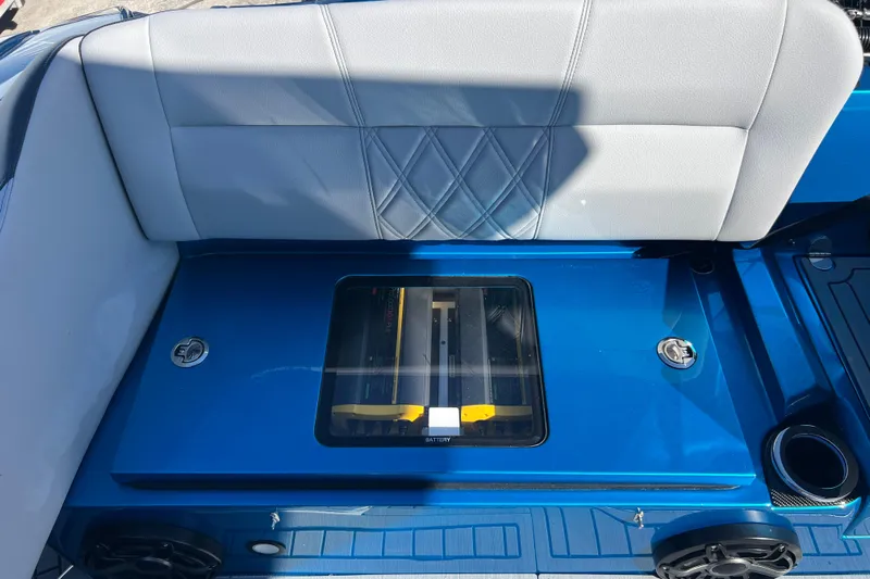  Yacht Photos Pics 2026 Nor-Tech 450 Sport boat interior with blue and gray seating and visible battery compartment.