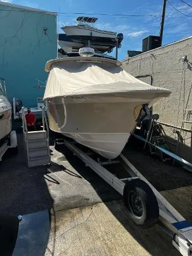  Yacht Photos Pics 2013 Grady-White Freedom 335 boat on trailer, covered, in a storage area.