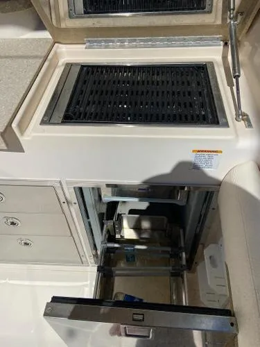  Yacht Photos Pics 2013 Grady-White Freedom 335 boat interior with grill and storage compartments.