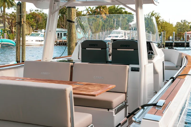 Next Yacht Photos Pics 2022 Fjord 38 Open luxury boat with spacious seating and sleek design.