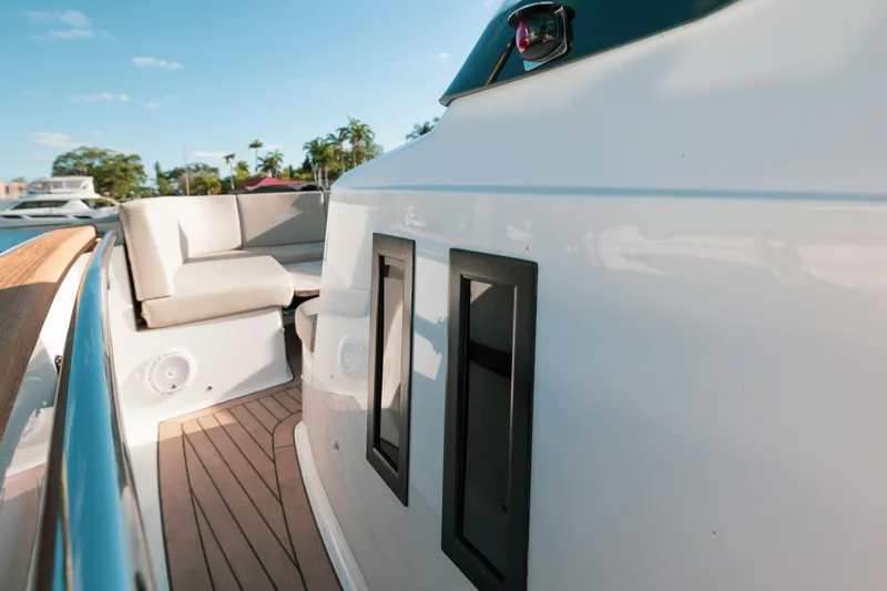 Next Yacht Photos Pics 2022 Fjord 38 Open yacht deck with seating and sleek design.