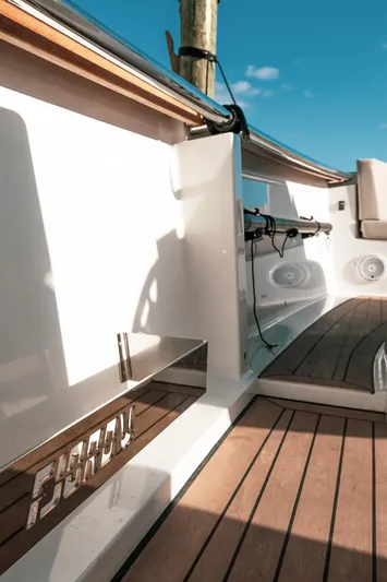 Next Yacht Photos Pics 2022 Fjord 38 Open boat deck with sleek wood finish and modern design.