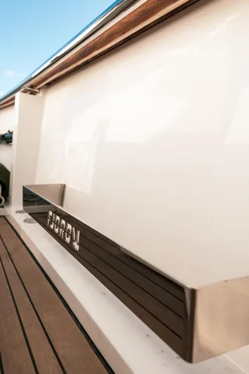 Next Yacht Photos Pics 2022 Fjord 38 Open yacht, sleek design, wooden deck detail.