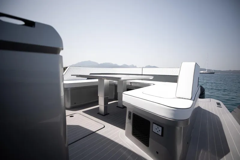  Yacht Photos Pics Maori 46 Outboard 2026: Luxurious boat deck with seating area.
