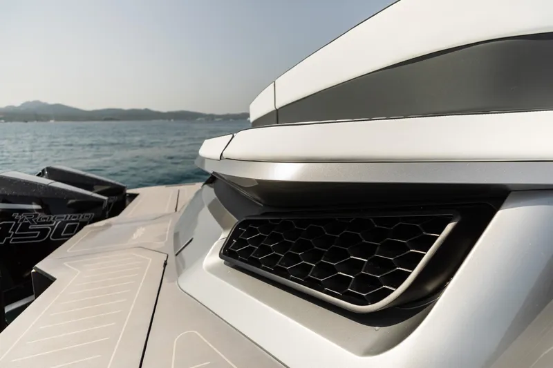  Yacht Photos Pics Close-up of Maori 46 outboard motor, 2026 model, on the water.