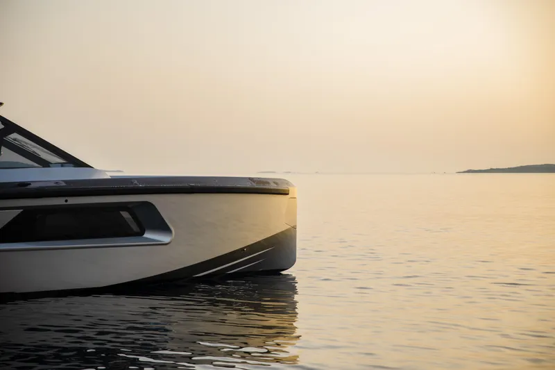  Yacht Photos Pics Maori 46 Outboard 2026 at sunset on calm waters.