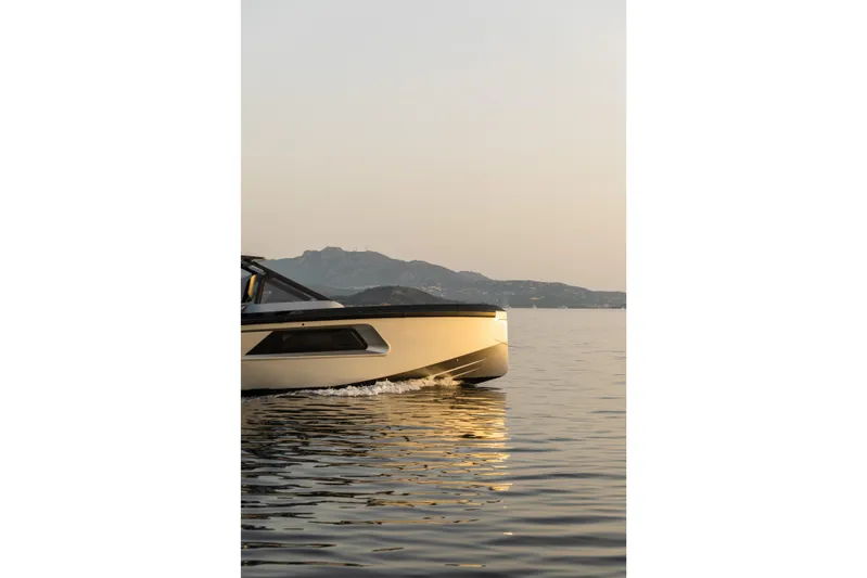  Yacht Photos Pics Maori 46 Outboard 2026 on calm water at sunset.