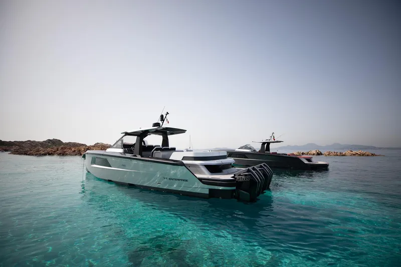  Yacht Photos Pics Maori 46 Outboard 2026 on clear water near rocky coastline.