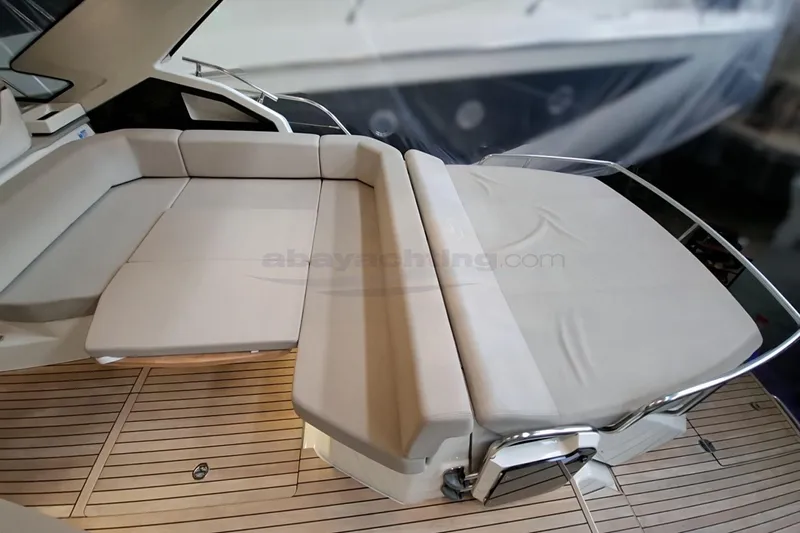  Yacht Photos Pics Luxurious seating area on 2020 Cranchi M44 HT yacht with sleek design and wooden flooring.