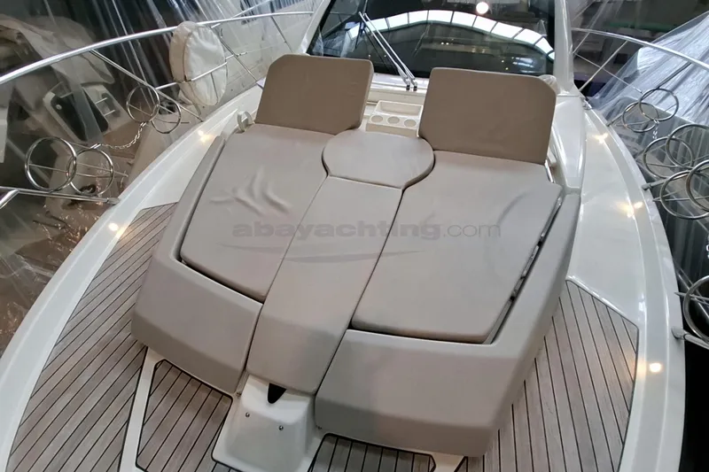 Yacht Photos Pics 2020 Cranchi M44 HT yacht with cushioned deck seating and sleek design.