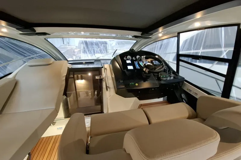  Yacht Photos Pics Interior of 2020 Cranchi M44 HT yacht with modern helm and luxurious seating.