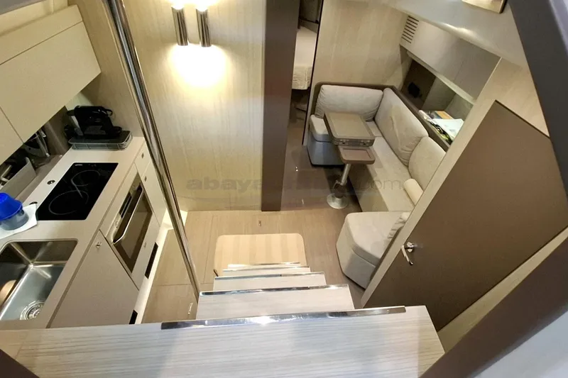  Yacht Photos Pics Luxurious interior of 2020 Cranchi M44 HT yacht with modern kitchen and cozy seating area.