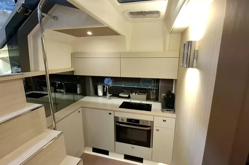  Yacht Photos Pics Modern kitchen interior of 2020 Cranchi M44 HT yacht, featuring sleek cabinetry and appliances.