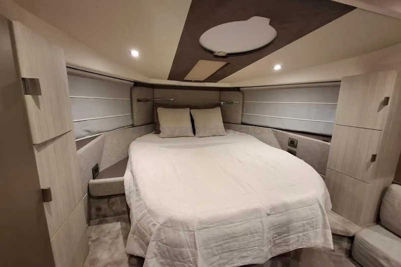  Yacht Photos Pics Luxurious bedroom interior of 2020 Cranchi M44 HT yacht with modern design.