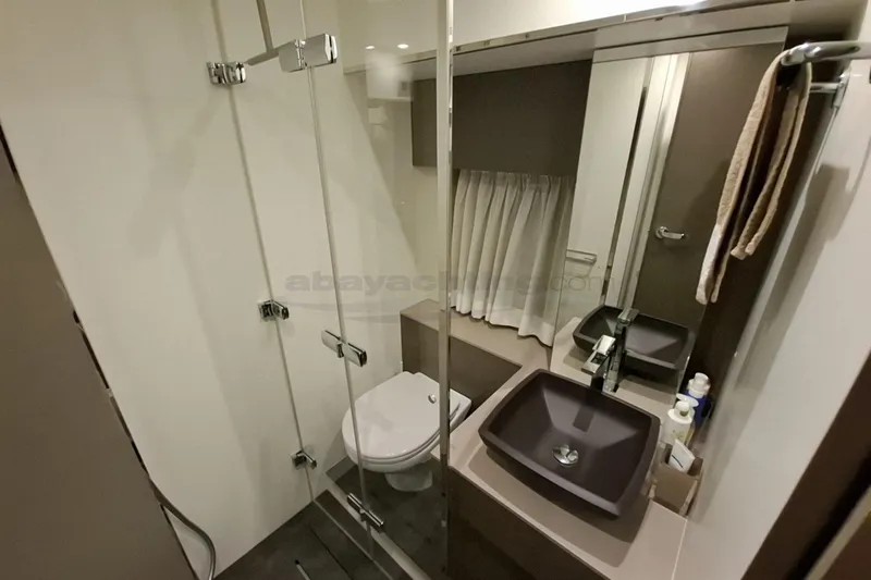  Yacht Photos Pics Modern bathroom in 2020 Cranchi M44 HT yacht with glass shower and sleek fixtures.