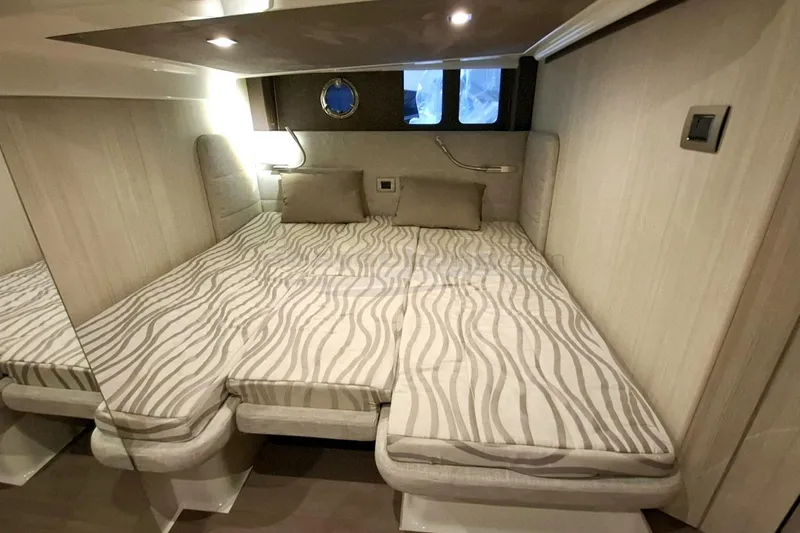  Yacht Photos Pics Luxurious cabin interior of 2020 Cranchi M44 HT yacht with modern bedding.