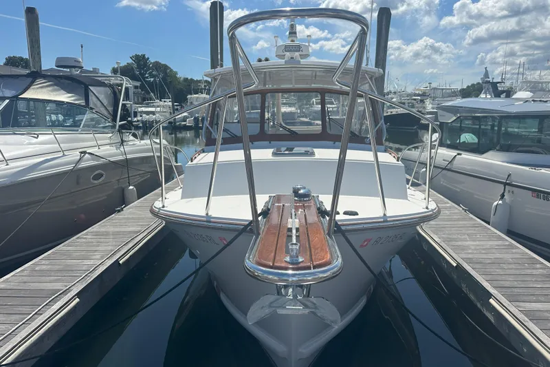 At Last 10 Yacht Photos Pics 2017 Fortier F-30 Hardtop boat docked at marina under blue sky.