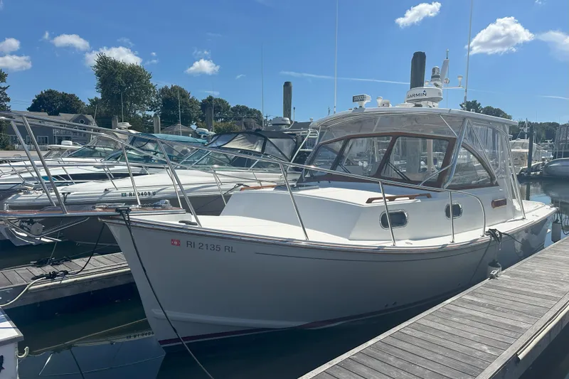 At Last 10 Yacht Photos Pics 2017 Fortier F-30 Hardtop boat docked at marina under clear blue sky.
