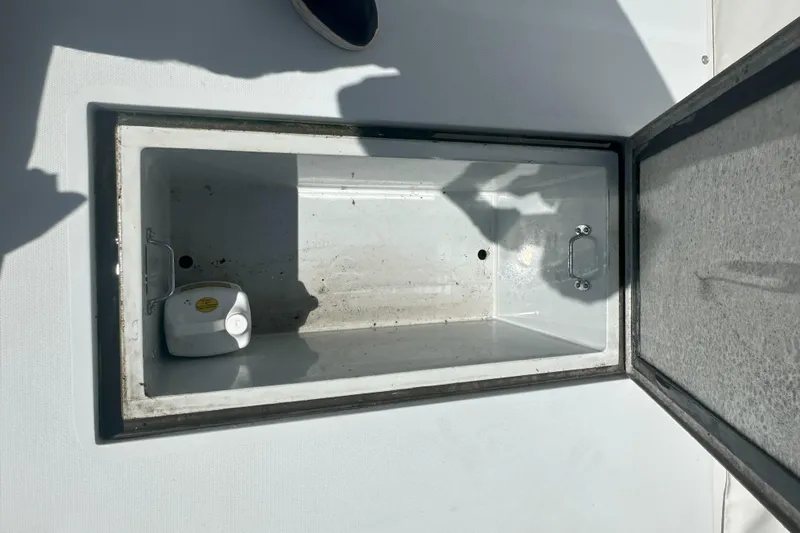 At Last 10 Yacht Photos Pics Open storage compartment on 2017 Fortier F-30 Hardtop boat deck.