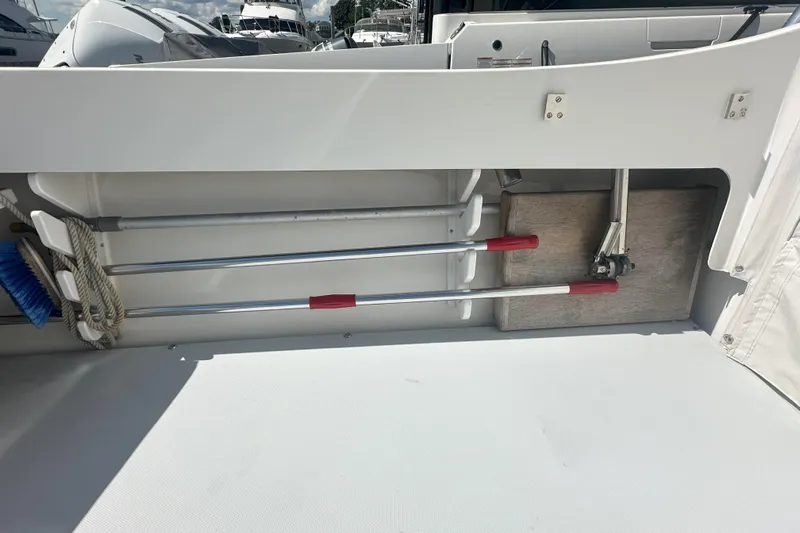 At Last 10 Yacht Photos Pics 2017 Fortier F-30 Hardtop boat storage area with cleaning tools and equipment.