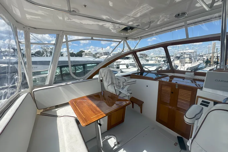 At Last 10 Yacht Photos Pics Interior of 2017 Fortier F-30 Hardtop boat with seating and navigation equipment.